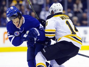 Leafs forward Trevor Moore gets checked at centre ice by Boston’s Chris Wagner at the Scotiabank Arena on Friday, November 15, 2019. (Stan Behal/Toronto Sun)