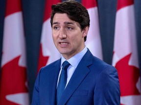 In this file photo taken on March 7, 2019 Prime Minister Justin Trudeau speaks to the media at the national press gallery in Ottawa. (LARS HAGBERG/AFP via Getty Images)