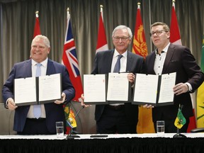 Ontario Premier Doug Ford, left, Premier Blaine Higgs of New Brunswick and Saskatchewan Premier Scott Moe announce a collaboration between the provinces on small, modular nuclear reactors on Sunday.