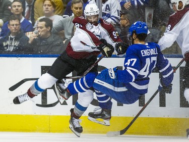 Toronto Maple Leafs Pierre Engvall is checked during 3rd period by Colorado Avalanche Nazem Kadri at the Scotiabank Arena in Toronto on Wednesday December 4, 2019. Ernest Doroszuk/Toronto Sun/Postmedia