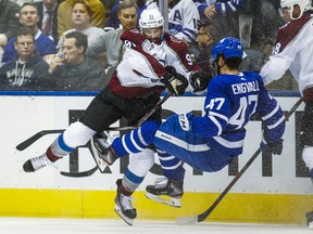 Toronto Maple Leafs Pierre Engvall is checked during 3rd period by Colorado Avalanche Nazem Kadri at the Scotiabank Arena in Toronto on Wednesday December 4, 2019. Ernest Doroszuk/Toronto Sun/Postmedia