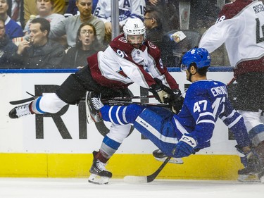 Toronto Maple Leafs Pierre Engvall is checked during 3rd period by Colorado Avalanche Nazem Kadri at the Scotiabank Arena in Toronto on Wednesday December 4, 2019. Ernest Doroszuk/Toronto Sun/Postmedia