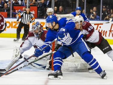 Toronto Maple Leafs Zach Hyman  during 3rd period action against Colorado Avalanche 	Samuel Girard and goalie Philipp Grubauer at the Scotiabank Arena in Toronto on Wednesday December 4, 2019. Ernest Doroszuk/Toronto Sun/Postmedia