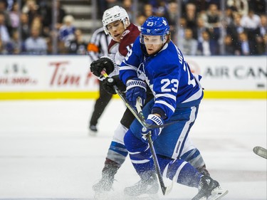 Toronto Maple Leafs Travis Dermott  during 3rd period action against Colorado Avalanche Matt Calvert at the Scotiabank Arena in Toronto on Wednesday December 4, 2019. Ernest Doroszuk/Toronto Sun/Postmedia