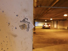 Toronto Police mark a bullet hole on Turf Grassway after two males were wounded on Tuesday, December 31, 2019. Jack Boland/Toronto Sun