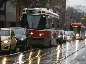 After 40 years the last remaining TTC Canadian Light Rail Streetcars( front) and the replacement cars behind, travel along Queen St E. on December 29, 2019.