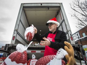 Second Harvest volunteer John Power loads donated turkeys onto a truck at the Loblaws at Dupont and Christie Sts. during the kick-off to the 17th annual turkey drive on Saturday, Dec. 7, 2019. (Ernest Doroszuk/Toronto Sun/Postmedia Network)