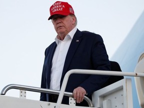 U.S. President Donald Trump descends from Air Force One at Palm Beach International Airport in West Palm Beach, Florida, U.S.  November 29, 2019.