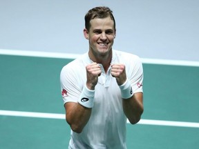 Vasek Pospisil of Canada celebrates a victory over Reilly Opelka of the United States during Davis Cup action at La Caja Magica in Madrid, Spain, on Nov. 19, 2019.