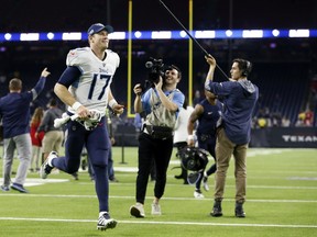Ryan Tannehill and the Tennessee Titans face the New England Patriots on Saturday. (GETTY IMAGES)