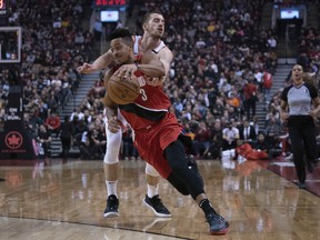 Portland Trail Blazers guard CJ McCollum  drives to the basket as Toronto Raptors guard Matt Thomas  defends during Tuesday's game. (USA TODAY SPORTS)