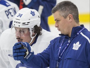 Head coach Sheldon Keefe (right) and Auston Matthews talk things over at a Maple Leafs practice. Craig Robertson/Toronto Sun/Postmedia Network