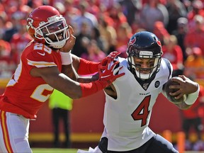 Quarterback Deshaun Watson #4 of the Houston Texans rushes against cornerback Kendall Fuller #29 of the Kansas City Chiefs during the first quarter at Arrowhead Stadium on October 13, 2019 in Kansas City, Missouri. (Peter Aiken/Getty Images)