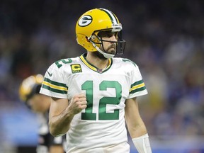 Aaron Rodgers of the Green Bay Packers celebrates his touchdown pass to Davante Adams of the Green Bay Packers in the third quarter against the Detroit Lions at Ford Field on December 29, 2019 in Detroit, Michigan.
