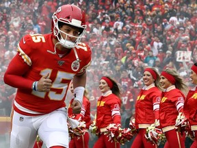 Quarterback Patrick Mahomes of the Kansas City Chiefs runs out of the tunnel as he is introduced prior to the game against the Los Angeles Chargers at Arrowhead Stadium on December 29, 2019 in Kansas City, Missouri.