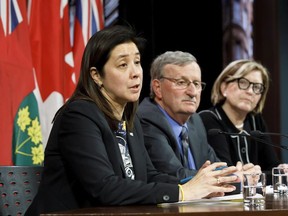 Dr. Eileen de Villa, Medical Officer of Health for the City of Toronto speaks as Dr. David Williams, the Chief Medical Officer of Ontario, and Dr. Barbara Yaffe, Ontario's Associate Chief Medical Officer of Health listen during a press briefing on the coronavirus at Queens Park on January 27, 2020 in Toronto, Canada.