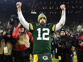 Aaron Rodgers of the Green Bay Packers celebrates after defeating the Seattle Seahawks 28-23 in the NFC Divisional Playoff game at Lambeau Field on January 12, 2020 in Green Bay, Wisconsin.