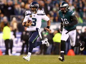 Seahawks quarterback Russell Wilson has proven adept at avoiding tacklers. (GETTY IMAGES)