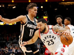 Fred VanVleet of the Toronto Raptors drives against Trae Young of the Atlanta Hawks in the first half at State Farm Arena on January 20, 2020 in Atlanta, Georgia.