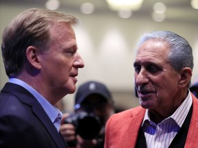 NFL Commissioner Roger Goodell speaks to Atlanta Falcons owner Arthur Blank prior to a press conference for Super Bowl LIV at the Hilton Miami Downtown on January 29, 2020 in Miami, Florida.