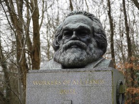 The bronze bust on top of the monument at the tomb of German revolutionary philosopher Karl Marx is pictured at a cemetery in north London. (AFP Photo)