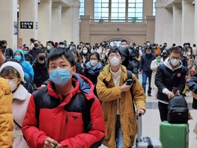 WUHAN, CHINA - JANUARY 22: People wear face masks as they wait at Hankou Railway Station on January 22, 2020 in Wuhan, China. (Getty Images)