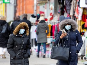 Pedestrians walk in  Toronto's Chinatown on Jan. 28, 2020. (Reuters)