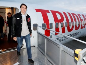 File photo of Prime Minister Justin Trudeau and his campaign plane during the election at the airport in Vancouver on a Oct. 12, 2019. (Reuters)