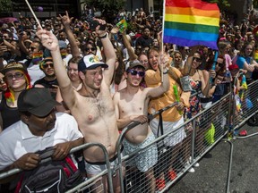 Spectators are pictured at last June's Pride parade along Yonge St. (Ernest Doroszuk, Toronto Sun)