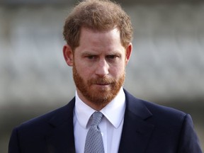 Prince Harry watches children play rugby league prior to the draw for the Rugby League World Cup 2021 at Buckingham Palace in London on Jan. 16, 2020. (AFP Photo)