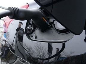 A car is charged at a charge station for electric vehicles on Parliament Hill in Ottawa on Wednesday, May 1, 2019.