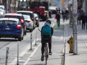 A cyclist in the bike lane along Bloor St. W., near Christie St., on May 9, 2019. (Ernest Doroszuk, Toronto Sun)