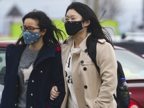 Many residents in the GTA, including these women outside the Pacific Mall in Markham, are wearing masks as they try to protect themselves from the Wuhan coronavirus. (Stan Behal, Toronto Sun)