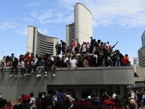 Fans gather at Nathan Phillips Square at City Hall during last June's Toronto Raptors championship parade.  (John E. Sokolowski-USA TODAY)