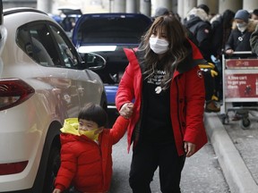 Passengers from three flights from China went through Pearson International Airport on Monday with no medical screening. (Jack Boland, Toronto Sun)