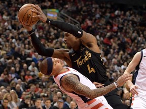 Toronto Raptors forward Rondae Hollis-Jefferson, right, drives to the basket and collides with Washington Wizards guard Isaiah Thomas in the fourth quarter at Scotiabank Arena in Toronto, Jan. 17, 2020. (Dan Hamilton-USA TODAY Sports)