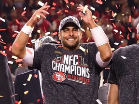San Francisco 49ers quarterback Jimmy Garoppolo celebrates after winning the NFC title game on Sunday. (USA TODAY SPORTS)