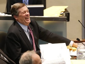 Mayor John Tory enjoys a laugh during the Toronto city Council meeting. (Toronto Sun file photo)