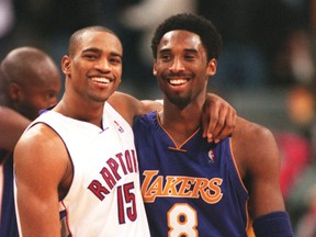 Vince Carter and Kobe Bryant hug after a game. (SUN FILES)