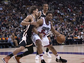 Toronto Raptors guard Kyle Lowry dribbles the ball as Atlanta Hawks guard Trae Young (left) defends during Tuesday's game. (USA TODAY SPORTS)