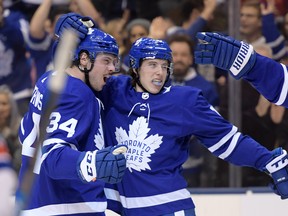 Maple Leafs forward Auston Matthews (34) celebrates with forward Mitchell Marner (16) after scoring against New York Rangers. Both players received a good grade from Lance Hornby.  Dan Hamilton-USA TODAY Sports