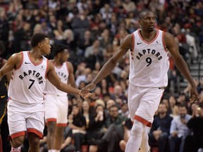 Toronto Raptors guard Kyle Lowry (7) slaps hands with centre Serge Ibaka (9) after scoring a basket against Cleveland Cavaliers in the second half at Scotiabank Arena. Dan Hamilton-USA TODAY Sports