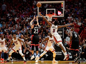 Toronto Raptors guard Fred VanVleet (23) shoots the ball against Miami Heat forward Derrick Jones Jr. (5) during the second half at American Airlines Arena. Jasen Vinlove-USA TODAY Sports