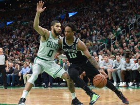 Spurs guard DeMar DeRozan (right) controls the ball while Boston Celtics’ Jayson Tatum defends.  USA TODAY Sports
