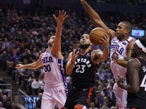 Philadelphia 76ers guard Furkan Korkmaz (30)  and forward Al Horford (42) try to block a shot attempt by Toronto Raptors guard Fred VanVleet (23) during the first half at Scotiabank Arena: John E. Sokolowski-USA TODAY Sports