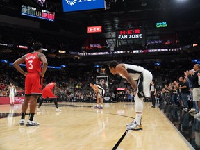 DeMar DeRozan looks on as fans cheer in honour of Kobe Bryant as the Spurs and Raptors let the play clock expire on each their respective first possessions to start the game on Sunday. DeRozan played through the game despite hearing about Bryant’s death before the start of the game.  USA TODAY Sports