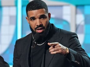 Canadian rapper Drake accepts the award for Best Rap Song for "Gods Plan" during the 61st Annual Grammy Awards on February 10, 2019, in Los Angeles.