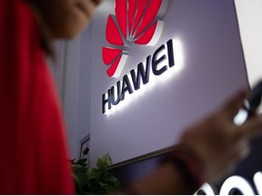 In this file photo taken on May 27, 2019 a Huawei logo is displayed at a retail store in Beijing.