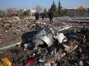 Rescue teams work amidst debris after a Ukrainian plane carrying 176 passengers crashed near Imam Khomeini airport in the Iranian capital Tehran early in the morning on Jan. 8, 2020, killing everyone on board.