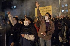 Iranians chant slogans and hold a placard reading in Farsi "Your mistake was unintentional, your lie was intentional" during a demonstration outside Tehran's Amir Kabir University on January 11, 2020. (Photo by STR/AFP via Getty Images)
